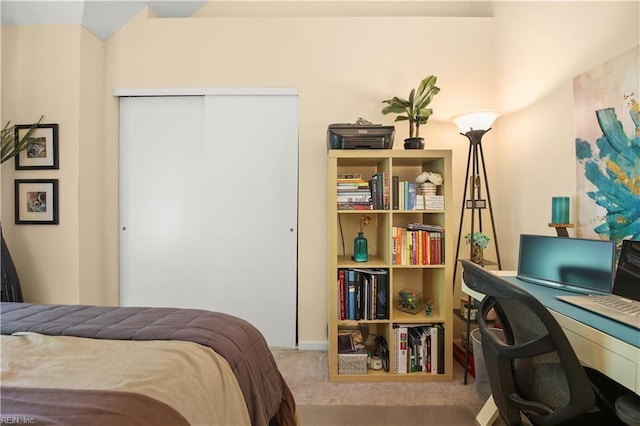 carpeted bedroom featuring a closet