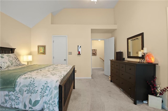 bedroom with high vaulted ceiling, baseboards, and light carpet