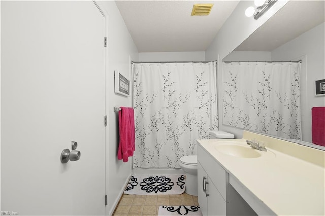 bathroom featuring visible vents, tile patterned flooring, vanity, toilet, and a shower with shower curtain
