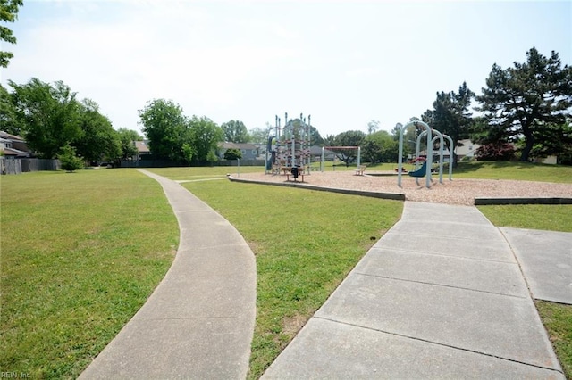 view of community with a lawn and playground community