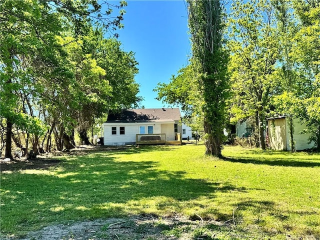 view of yard featuring a wooden deck
