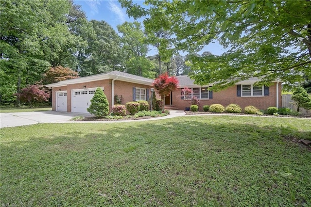 ranch-style house featuring an attached garage, a front lawn, brick siding, and concrete driveway