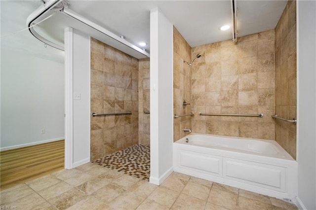 full bathroom featuring shower / tub combination, recessed lighting, and baseboards