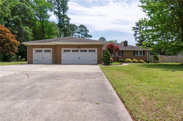 ranch-style home with a front lawn, fence, brick siding, concrete driveway, and an attached garage