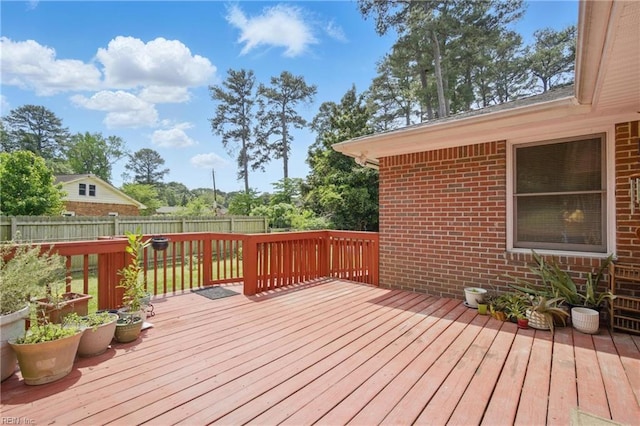 wooden deck featuring fence