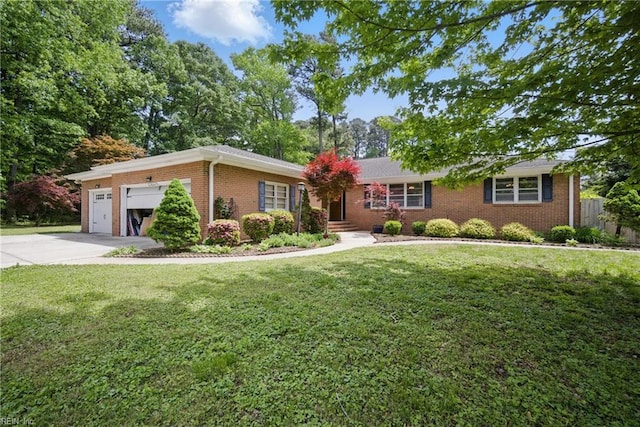ranch-style house with brick siding, a garage, driveway, and a front lawn