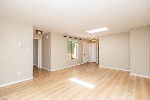 1103 Black Duck Ct, Virginia Beach, VA 23451 - unfurnished room with a skylight, baseboards, and light wood finished floors