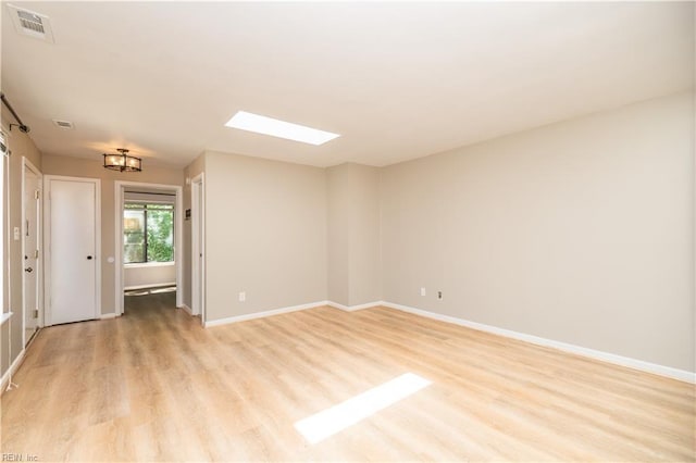 1103 Black Duck Ct, Virginia Beach, VA 23451 - unfurnished room featuring a skylight, baseboards, light wood-type flooring, and visible vents