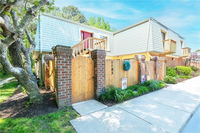 1103 Black Duck Ct, Virginia Beach, VA 23451 - exterior space featuring brick siding, fence, and a gate