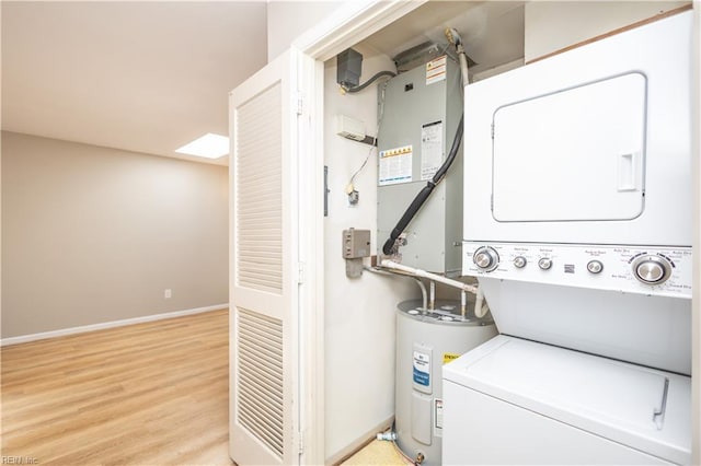 1103 Black Duck Ct, Virginia Beach, VA 23451 - laundry area featuring light wood-style floors, laundry area, water heater, and stacked washer / drying machine