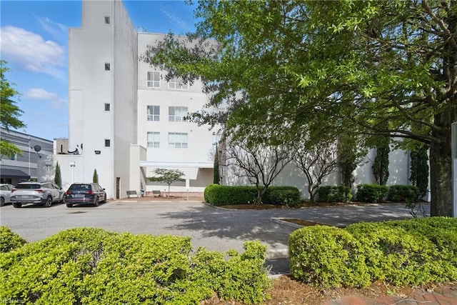 view of property with uncovered parking
