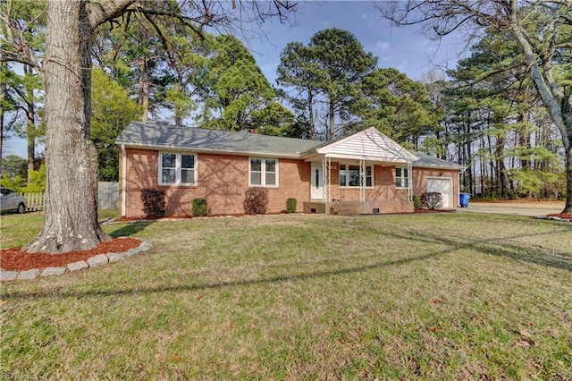 ranch-style house featuring an attached garage, a front lawn, and brick siding