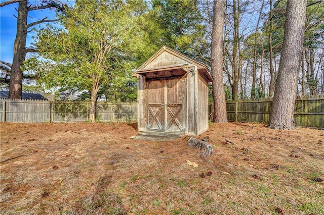 view of shed with a fenced backyard