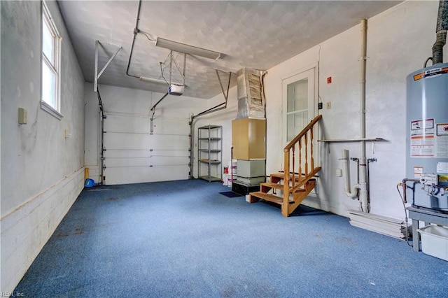 garage with a garage door opener and gas water heater