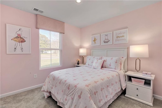 bedroom with baseboards, visible vents, and carpet