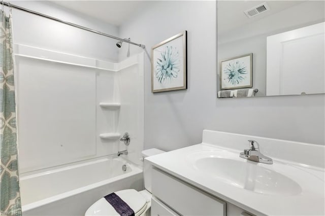bathroom featuring shower / bath combo with shower curtain, visible vents, toilet, and vanity