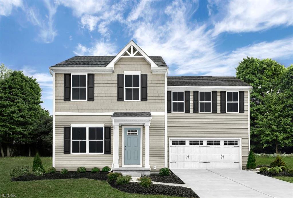 view of front of property with a shingled roof, an attached garage, concrete driveway, and a front yard
