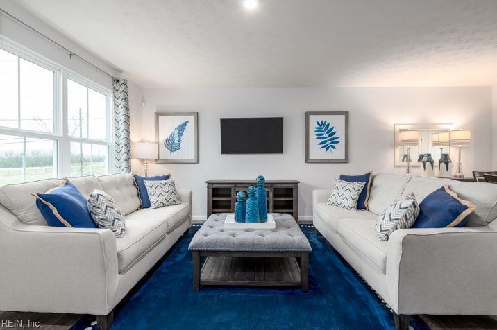 living area featuring baseboards