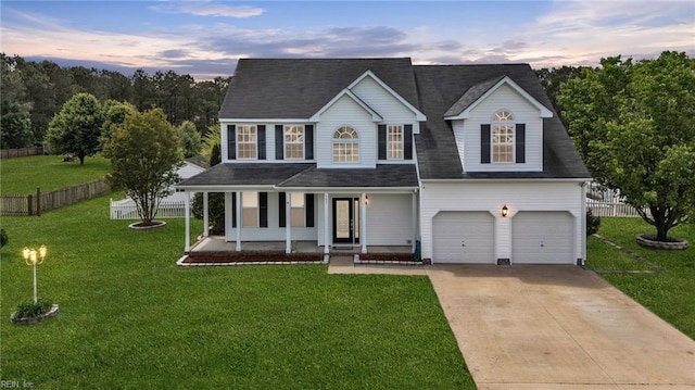 157 Pier Lndg, South Mills, NC 27976 - view of front of house featuring fence, an attached garage, driveway, and a front yard