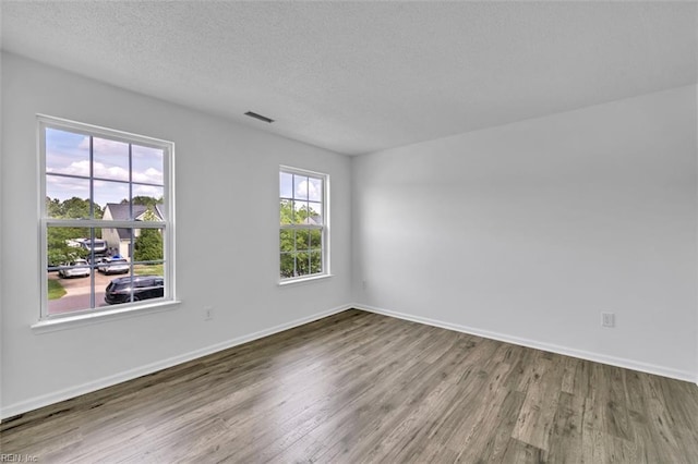 157 Pier Lndg, South Mills, NC 27976 - empty room featuring baseboards, a textured ceiling, wood finished floors, and visible vents