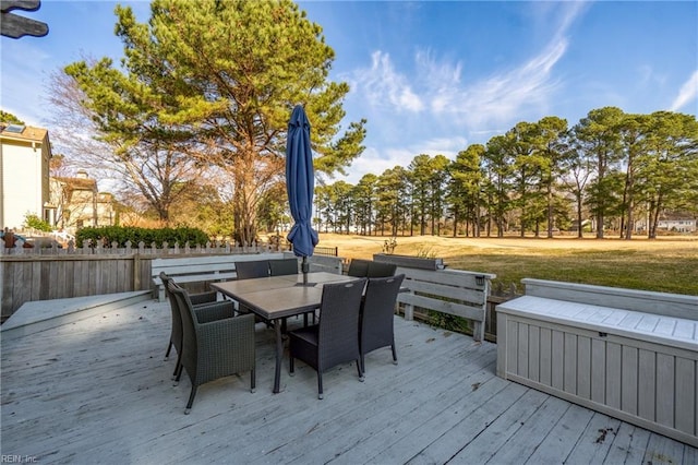 wooden deck featuring outdoor dining area