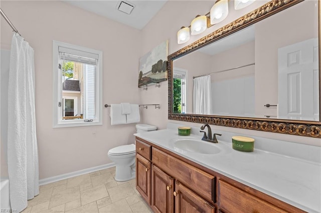 bathroom featuring vanity, toilet, a shower with shower curtain, baseboards, and visible vents