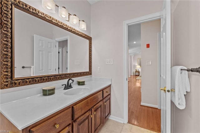 bathroom with vanity and baseboards