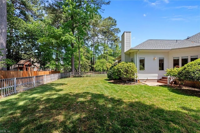 view of yard featuring a fenced backyard