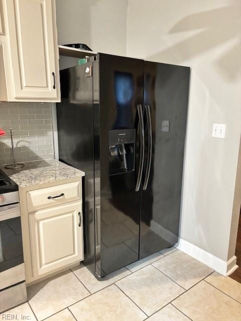 639 Mt Vernon Ave, Portsmouth, VA 23707 - kitchen featuring decorative backsplash, stainless steel electric range oven, light stone countertops, black fridge with ice dispenser, and baseboards