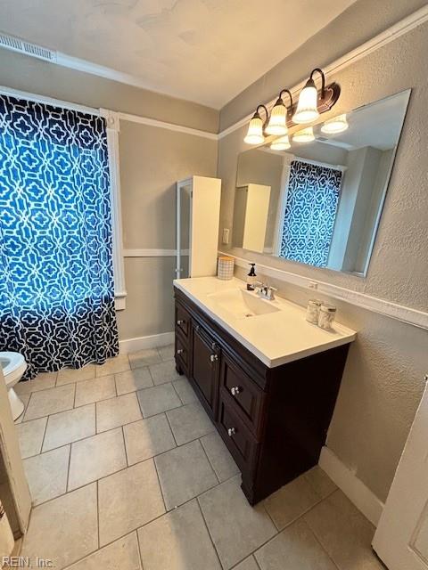 639 Mt Vernon Ave, Portsmouth, VA 23707 - bathroom featuring vanity, a textured wall, toilet, and tile patterned floors