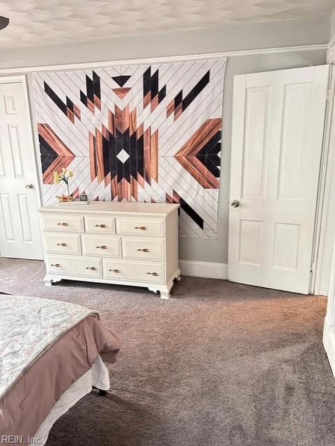 639 Mt Vernon Ave, Portsmouth, VA 23707 - bedroom with dark carpet and baseboards