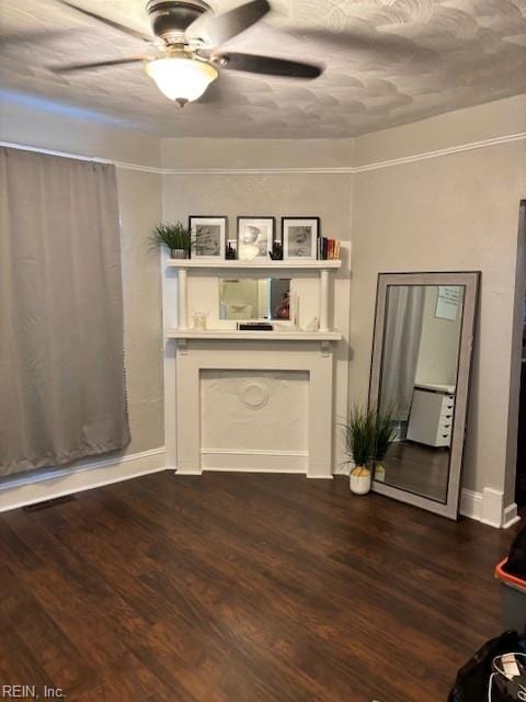 639 Mt Vernon Ave, Portsmouth, VA 23707 - unfurnished living room with dark wood-style flooring, a ceiling fan, and baseboards