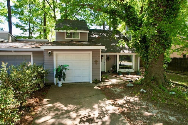 820 Pine Tree Ct, Newport News, VA 23608 - view of front of home featuring concrete driveway, fence, and a garage