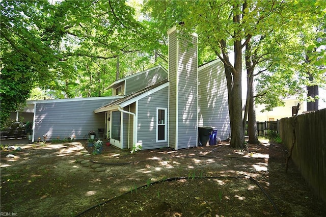 820 Pine Tree Ct, Newport News, VA 23608 - rear view of property with fence and a chimney