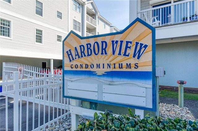 community sign with fence