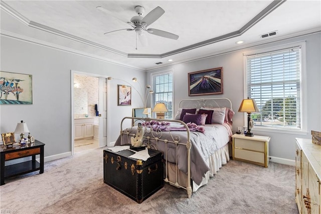bedroom with crown molding, light carpet, ensuite bath, baseboards, and visible vents