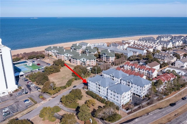 drone / aerial view featuring a water view and a beach view