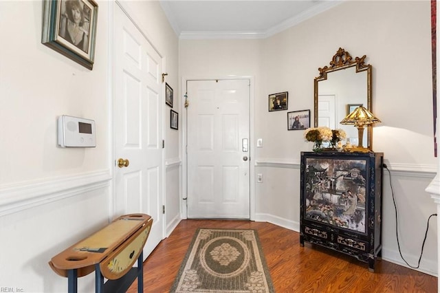 doorway featuring crown molding and wood finished floors