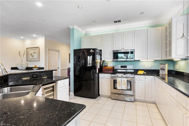 kitchen featuring visible vents, a sink, beverage cooler, stainless steel appliances, and light tile patterned flooring