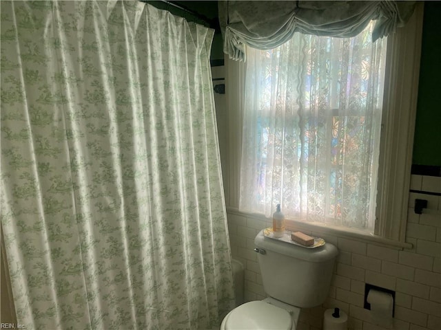114 Thomas St, Smithfield, VA 23430 - bathroom with toilet and tile walls