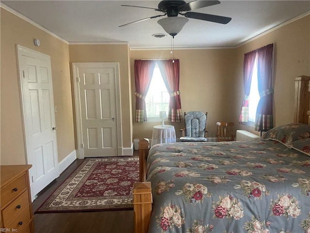 bedroom featuring crown molding, a ceiling fan, baseboards, and wood finished floors