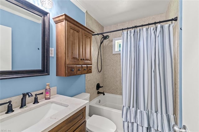 full bathroom with vanity, shower / tub combo, and toilet