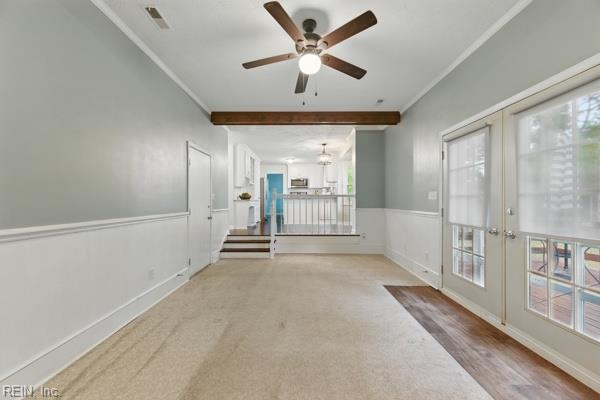 2 Sarfan Dr, Hampton, VA 23664 - spare room with crown molding, a wealth of natural light, french doors, and ceiling fan with notable chandelier