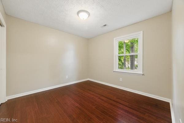 2 Sarfan Dr, Hampton, VA 23664 - empty room with baseboards, a textured ceiling, and dark wood-style floors
