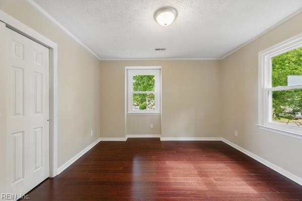 2 Sarfan Dr, Hampton, VA 23664 - empty room featuring baseboards, visible vents, a wealth of natural light, and wood finished floors