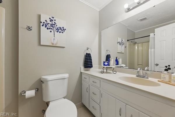 2 Sarfan Dr, Hampton, VA 23664 - full bathroom with crown molding, visible vents, vanity, curtained shower, and toilet