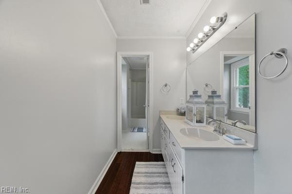 2 Sarfan Dr, Hampton, VA 23664 - bathroom featuring baseboards, wood finished floors, vanity, and ornamental molding