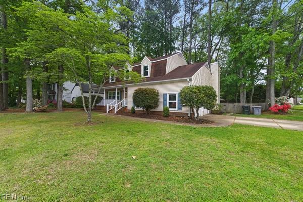 2 Sarfan Dr, Hampton, VA 23664 - cape cod home featuring an attached garage, concrete driveway, a porch, and a front lawn