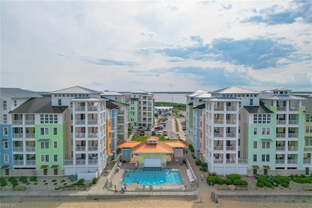 view of building exterior with a community pool