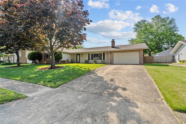 ranch-style home with fence, a chimney, brick siding, an attached garage, and driveway